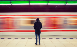 person watching a subway train go by